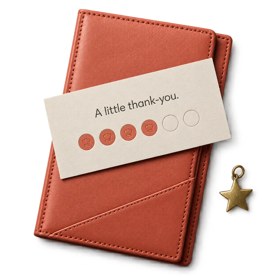 A textured coral check presenter holding a loyalty card and a small brass star.